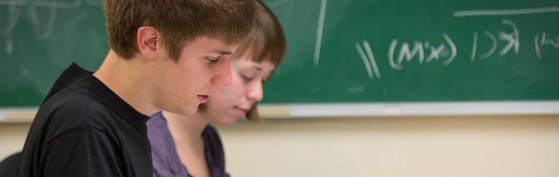 Male and female students in Physics lecture