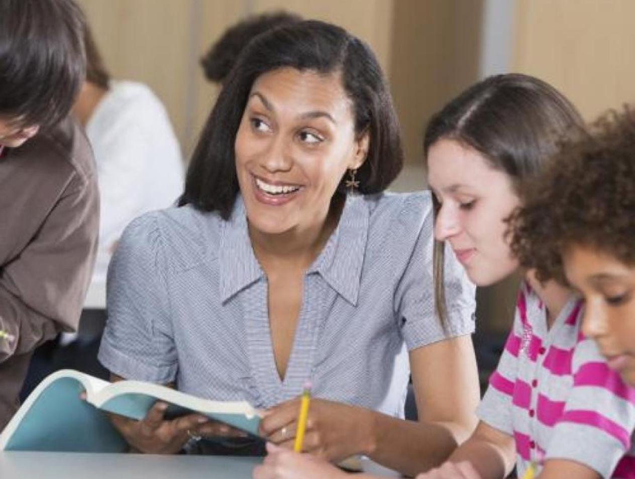 Teacher working with students